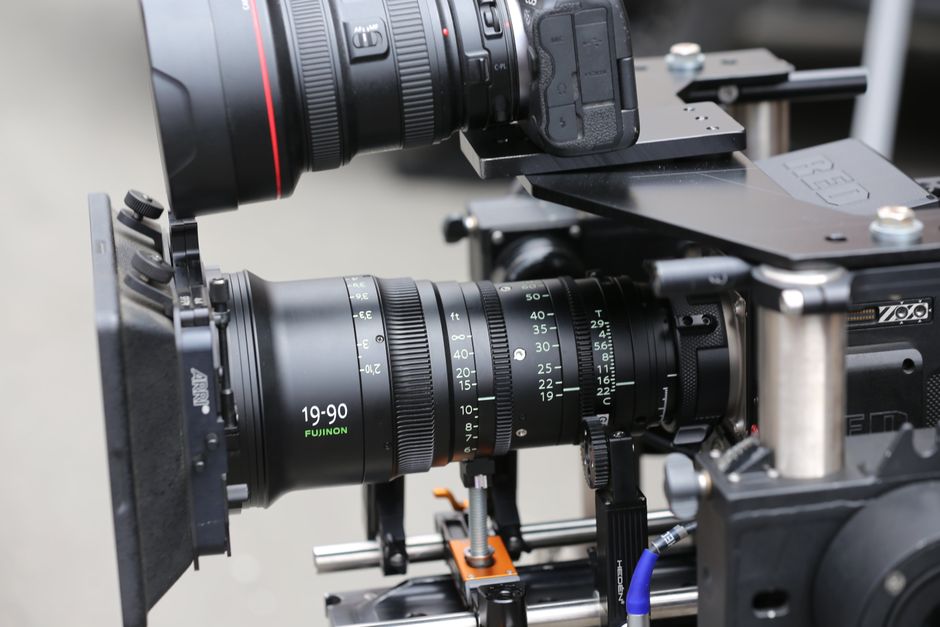 Close-up of a professional camera lens mounted on a rig, perfect for technology and film themes.